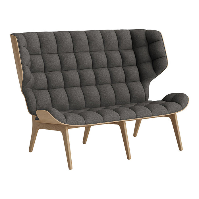 Gray tufted sofa with a modern design and natural wood legs, featuring a distinctive high backrest.