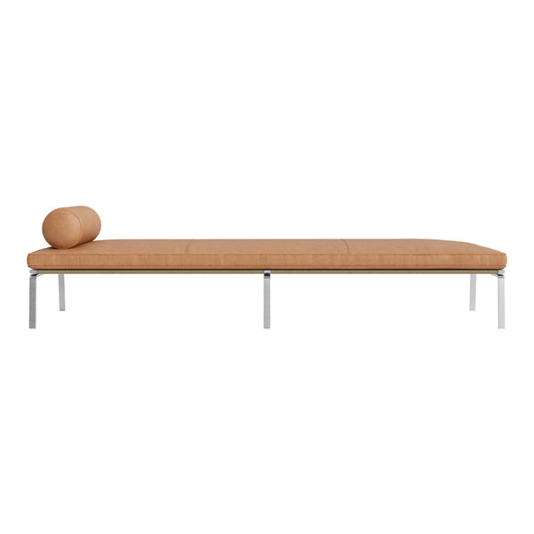 Tan fabric chaise lounge with a sleek silver frame and a cylindrical bolster pillow. Minimalist design and modern aesthetic.