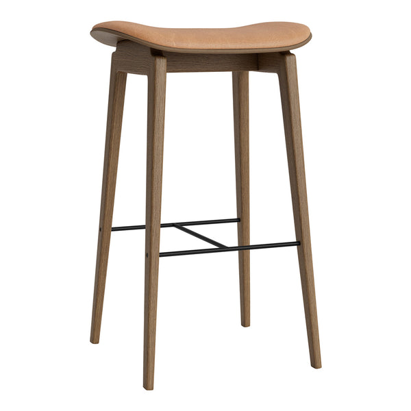 Light wood bar stool with a smooth, curved seat and tapered legs, featuring a sleek black footrest.