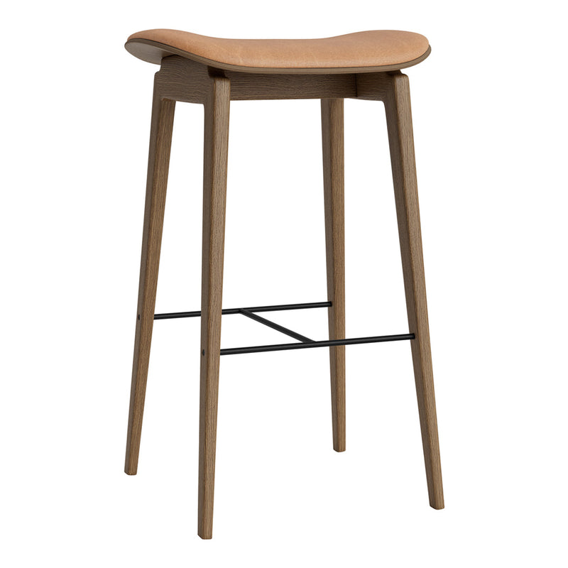 Light wood bar stool with a smooth, curved seat and tapered legs, featuring a sleek black footrest.