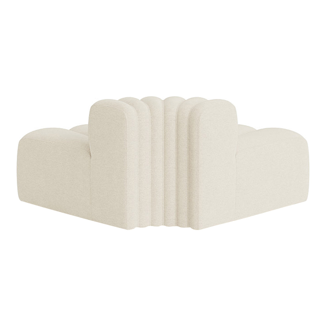 Cream-colored upholstered corner sofa with soft ribbed texture and smooth, rounded contours.