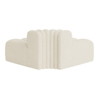 Cream-colored upholstered corner sofa with soft ribbed texture and smooth, rounded contours.