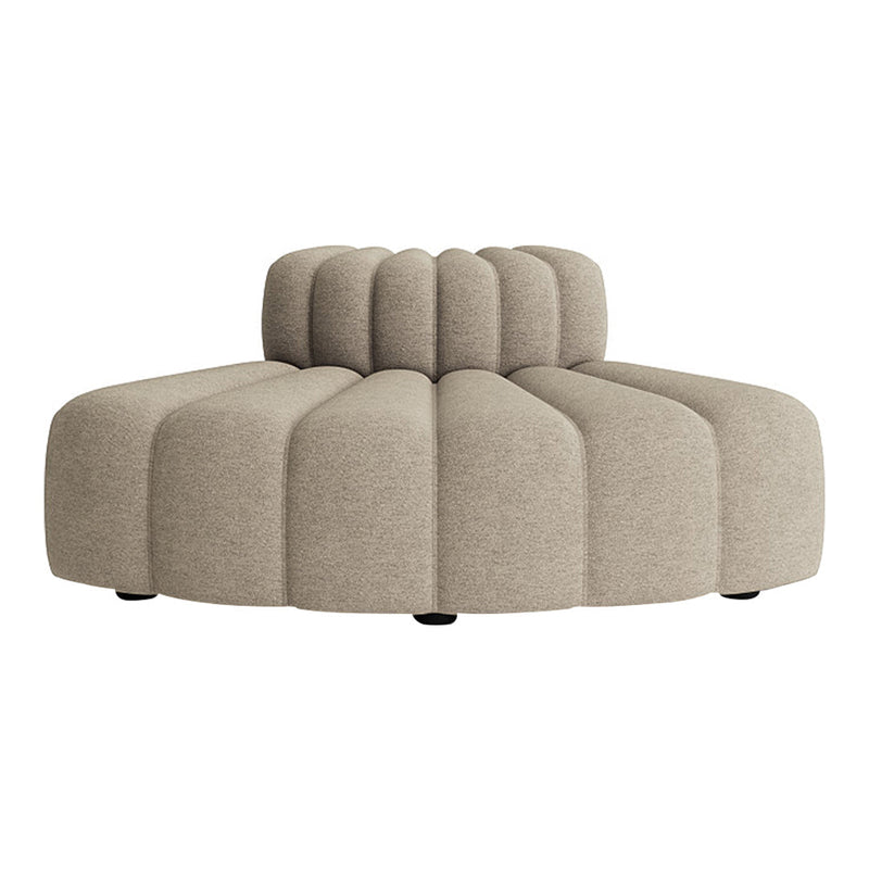Beige plush sofa with a curved, ribbed design, featuring round and smooth shapes for a modern aesthetic.