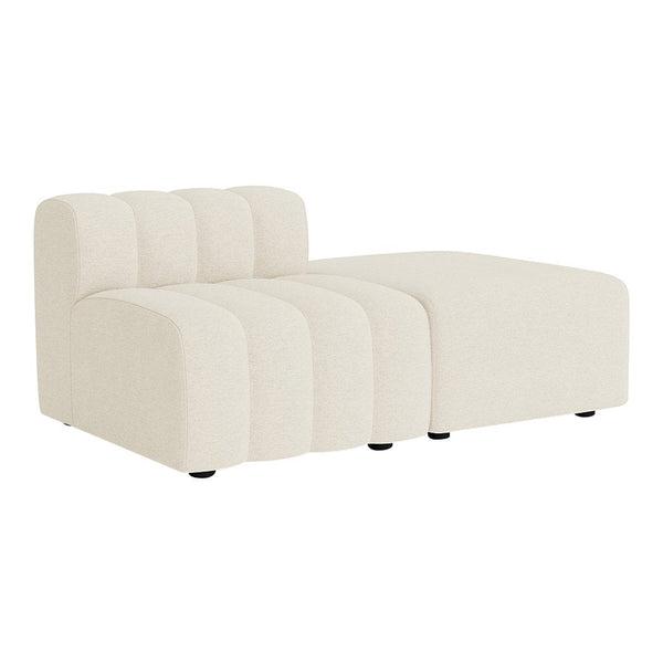 Cream-colored chaise lounge with a soft, ribbed texture and rounded edges for a modern look. Perfect for any decor.