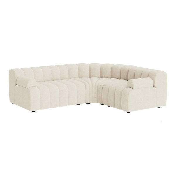 Cream-colored couch with a tufted design, featuring smooth lines and modern aesthetics for a stylish living space.