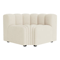 Cream-colored curved sectional sofa with soft ribbed texture and rounded edges, ideal for modern living spaces.