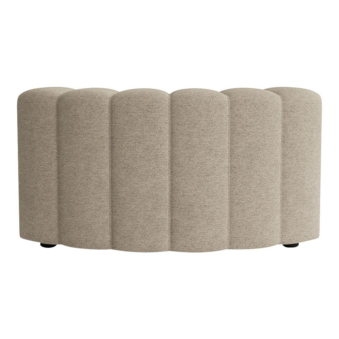 Beige upholstered bench with curved segments, featuring a soft, textured fabric and minimalist design.