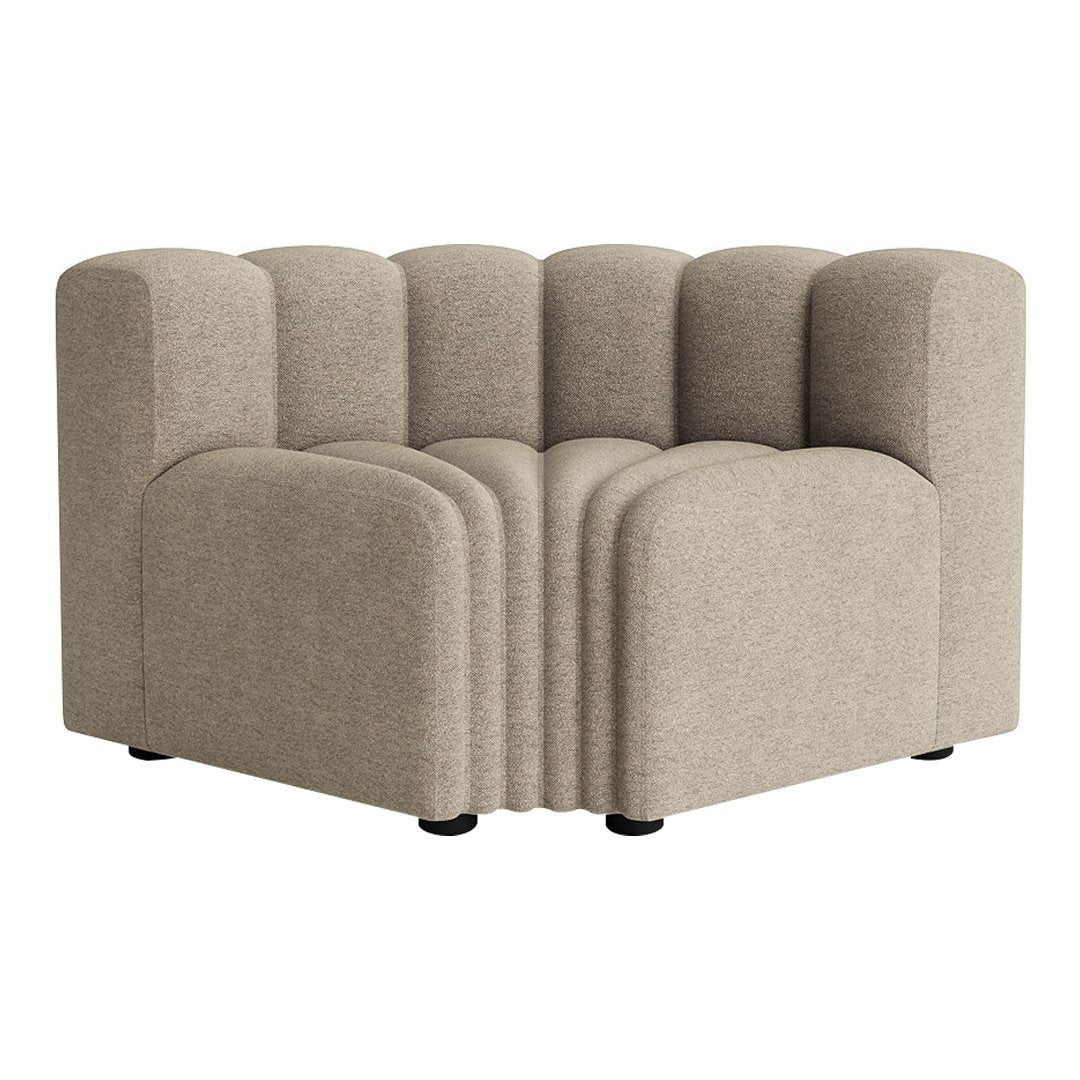 Beige curved couch with a soft, textured fabric and modern ribbed design. Perfect for contemporary living spaces.