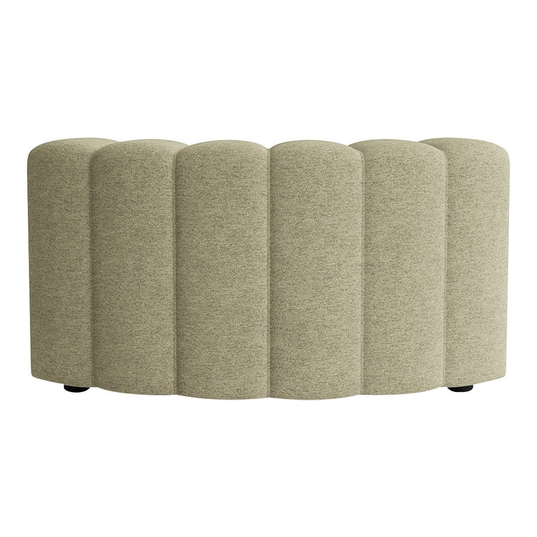 Curved, upholstered bench in soft beige with textured, ribbed pattern for modern decor.
