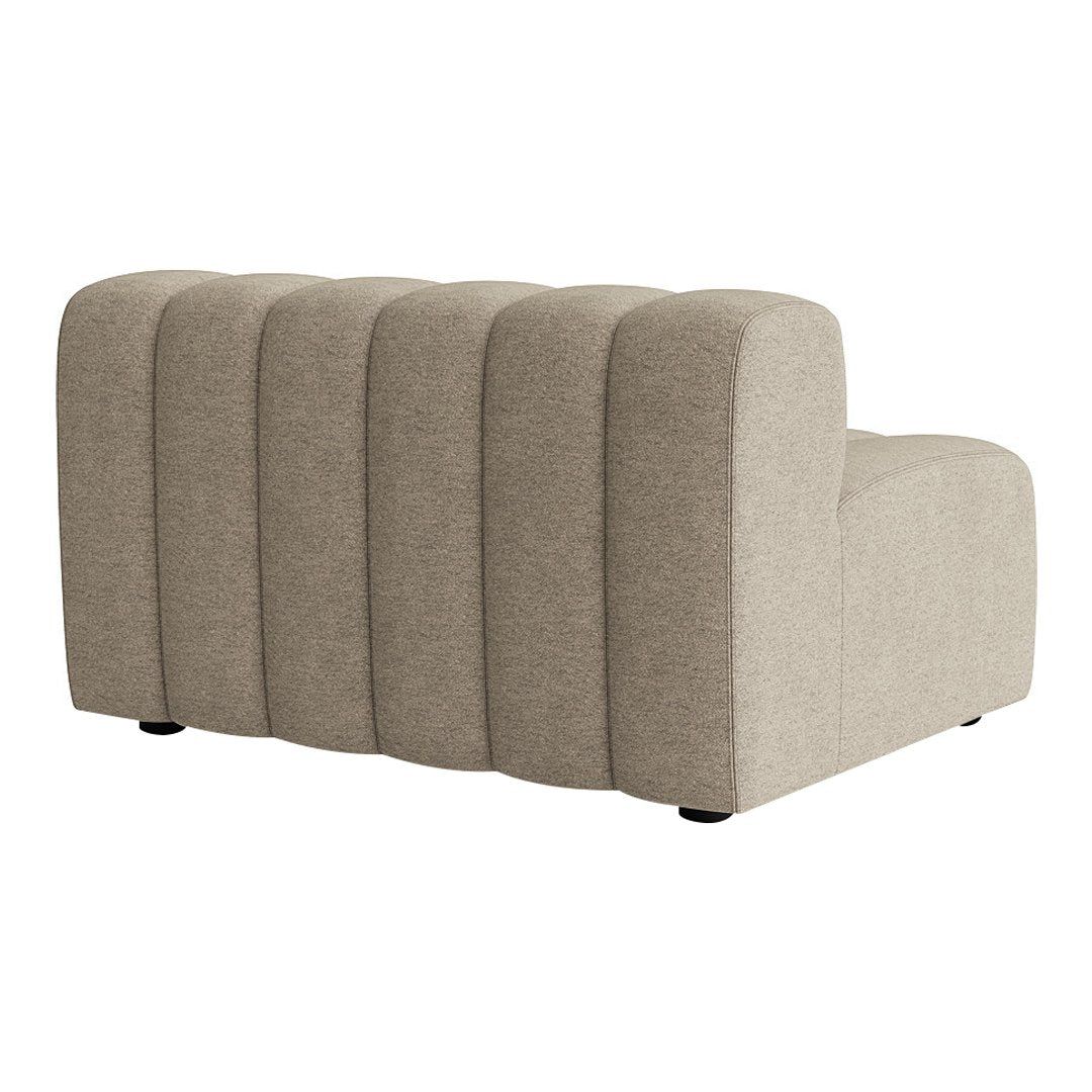 Beige textured fabric sectional sofa with curved lines and subtle ribbed pattern, adding modern elegance to any space.