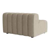 Beige textured fabric sectional sofa with curved lines and subtle ribbed pattern, adding modern elegance to any space.