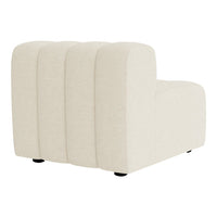 Beige upholstered accent chair with a ribbed texture and smooth, clean lines. Ideal for modern interiors.