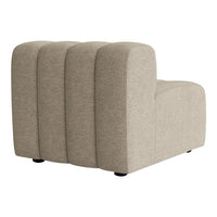 Textured beige fabric accent chair with curved shapes and subtle lines, perfect for modern decor.