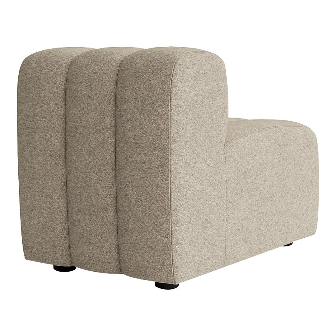 Curved beige upholstered sofa segment with a smooth, textured surface and rounded edges.