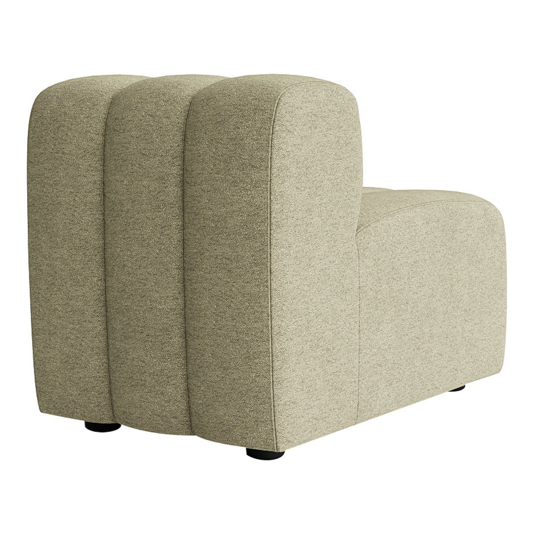 Light beige upholstered chair with smooth, curved lines and a textured fabric finish. Soft, minimalist design.