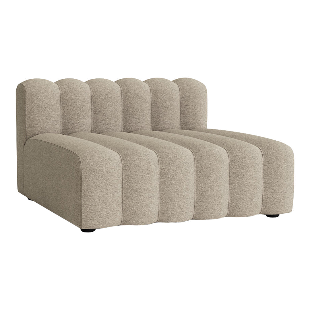 Beige sectional sofa with soft, curved lines and a textured pattern for a modern aesthetic.