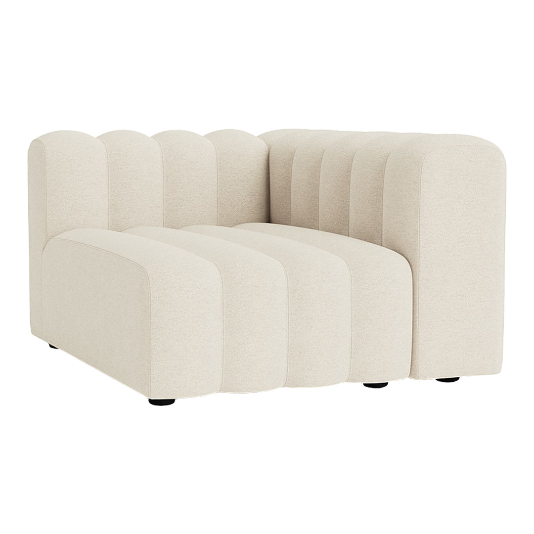 Beige, textured fabric sectional sofa with wavy pattern and rounded edges, offering a modern and cozy look.