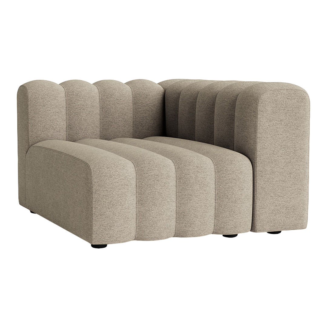 Beige upholstered corner sofa with curved, ribbed patterns and a modern design.