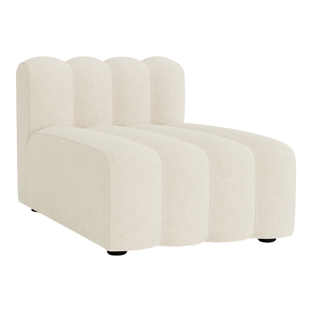 Curved cream chaise lounge with a plush texture and subtle ribbed pattern. Modern minimalist design for stylish interiors.