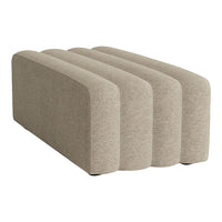 Beige, textured upholstery with a smooth, curved design, featuring three modular sections for versatile styling.