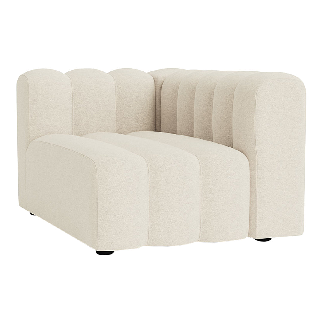 Cream-colored modular sofa with a sleek, ribbed texture and soft, rounded edges for a modern look.