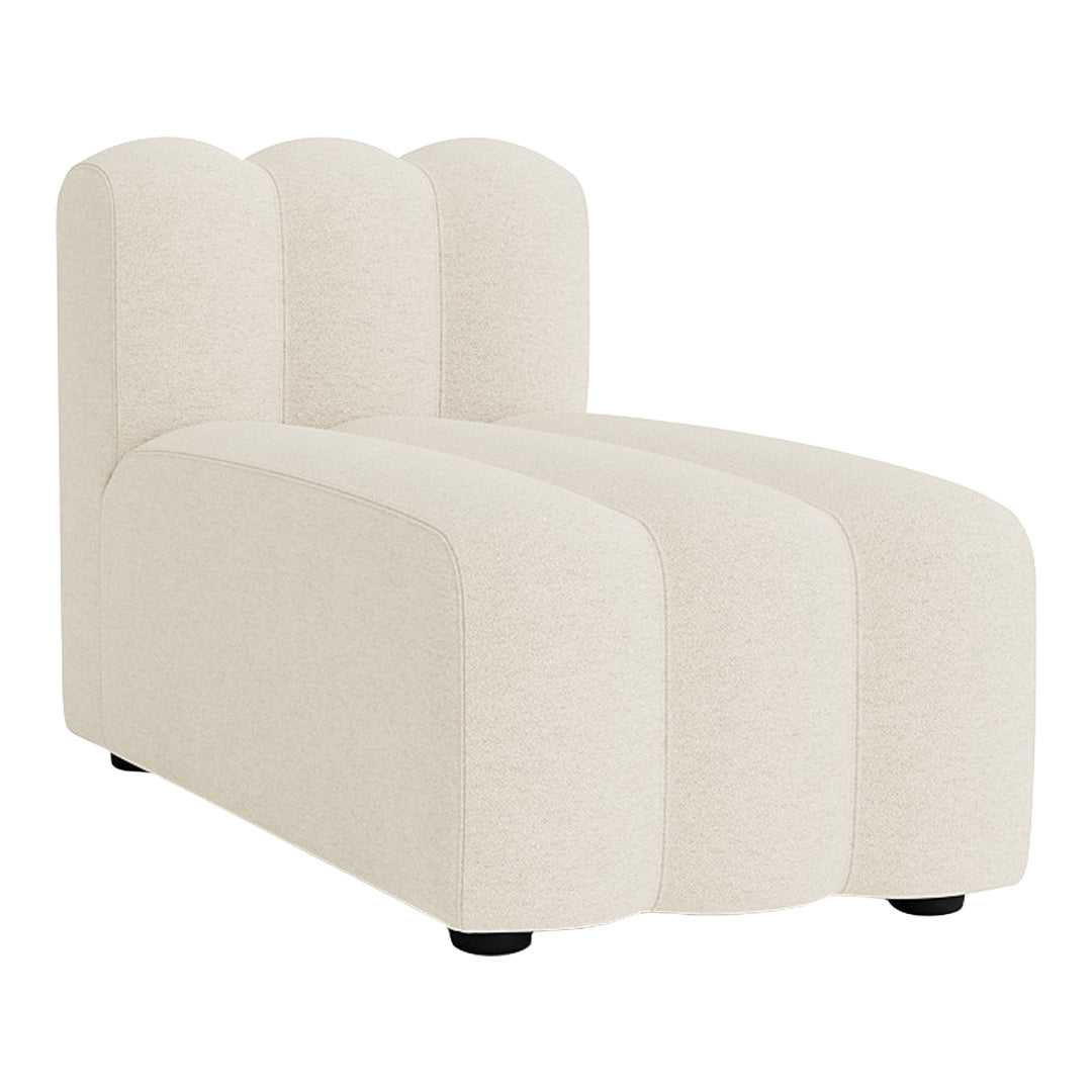 Cream-colored chaise lounge with textured fabric and a sleek, modern silhouette featuring soft, curved lines.