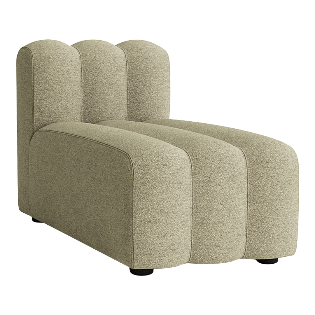 Textured beige upholstered chaise lounge with a sleek, modern design and soft, curved contours.