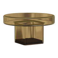 Stylish round coffee table in amber glass with dark wooden base. Modern design with smooth, glossy finish.