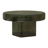 Green glass coffee table with a smooth round top and geometric base, featuring a modern, minimalist design.