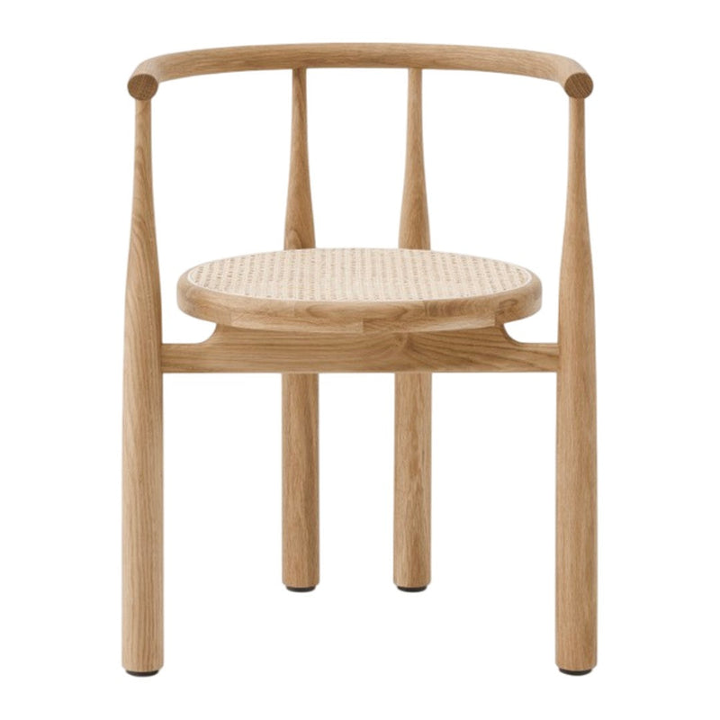 Natural wood chair with a light oak finish and woven cane seat, featuring subtle textures and a minimalist design.