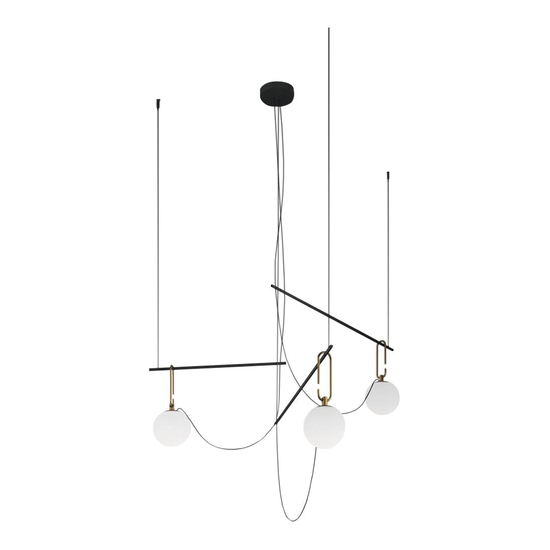 Modern chandelier featuring black metal, brass accents, and white globe shades for a stylish contrast.