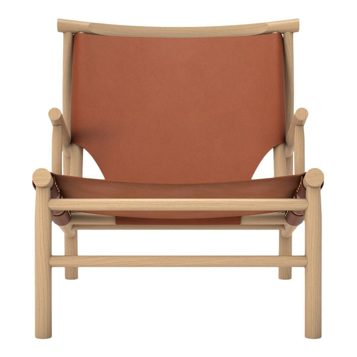 Light wood armchair with a warm terracotta seat and backrest, featuring a minimalist design and clean lines.