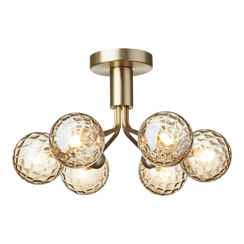 "Brass ceiling light fixture with five textured glass globes in warm amber tones, adding modern elegance to any space."
