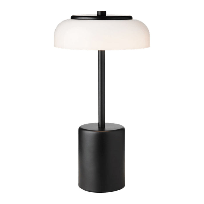 Modern black lamp with a sleek cylindrical base and a frosted white dome-shaped shade. Minimalist design.