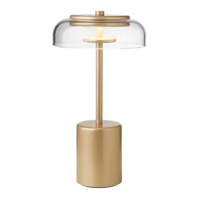 Gold and clear glass table lamp with a sleek, modern design and minimalist aesthetic. Perfect for stylish decor.