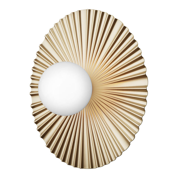 Gold fluted wall sconce with a white orb, featuring a radiant sunburst design. Elegant and modern decor accent.