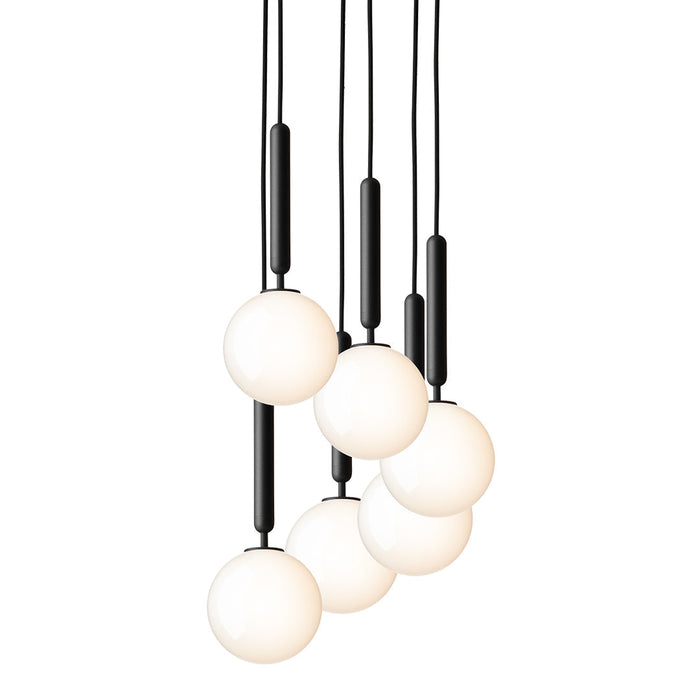 Black and white pendant light featuring five spherical globes and sleek black fittings, ideal for modern decor.