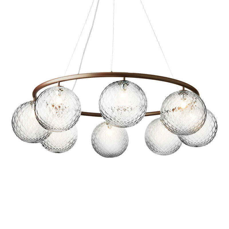 Modern chandelier with nine crystal globes and a gold metal ring, featuring a sleek, contemporary design.