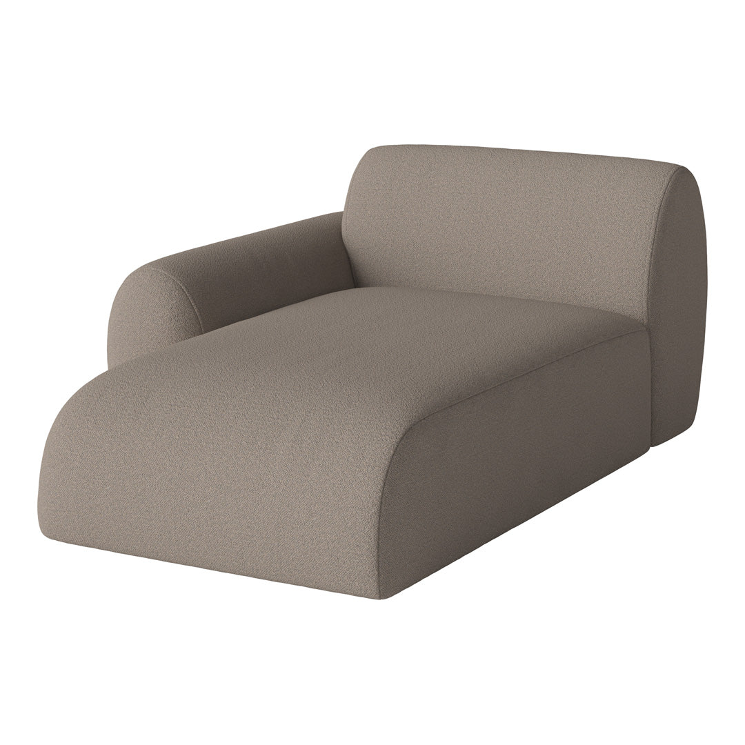 Beige upholstered chaise lounge with a smooth, textured fabric and modern curved design. Perfect for any living space.