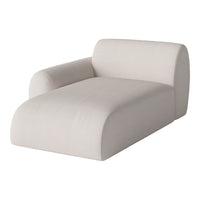 Beige modern chaise lounge with smooth, minimalist fabric and subtle textured pattern for a chic look.