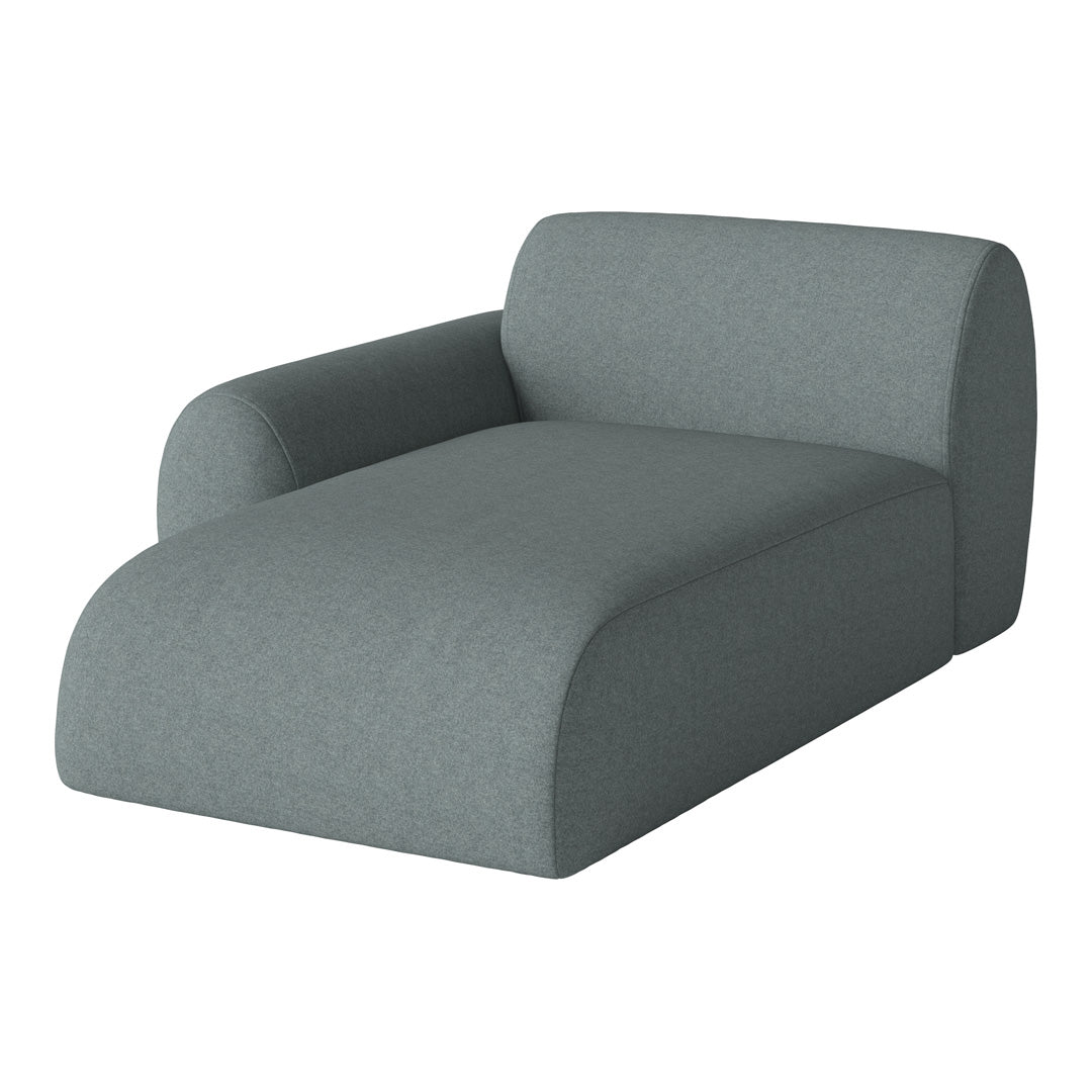 Sleek, modern chaise lounge in soft, muted gray fabric with a smooth, solid color finish.