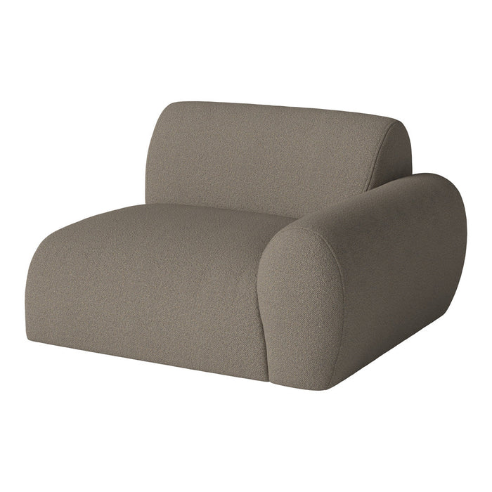Soft taupe armchair with a textured fabric and rounded edges, perfect for modern interior decor.