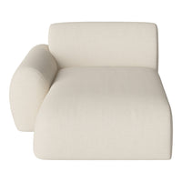 Cream colored textured chaise lounge with a soft, modern design. Perfect for a minimalist decor.