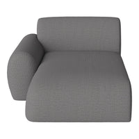 Gray textured upholstery chaise lounge with a minimalist design and modern curves. Perfect for contemporary interiors.