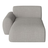 Gray upholstered chaise lounge with a textured fabric pattern and modern, minimalist design.