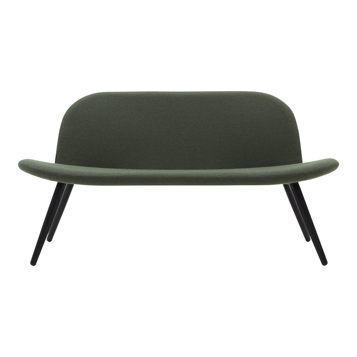 Green upholstered sofa with a smooth, curved shape and sleek black wooden legs. Modern minimalist design.