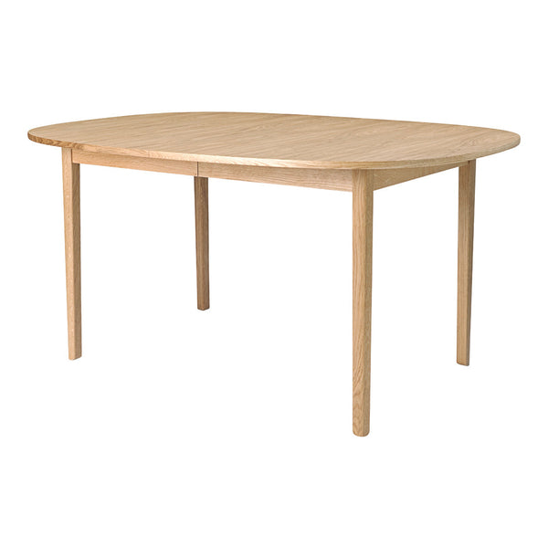 Natural wood dining table with a smooth, light finish and rounded edges, perfect for modern or rustic decor.