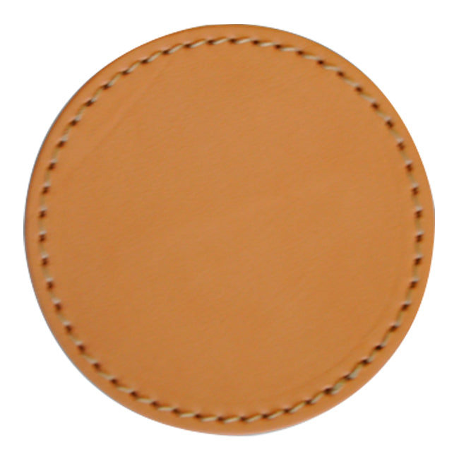 Tan leather round coaster with a stitched edge, showcasing a smooth and minimalist design.
