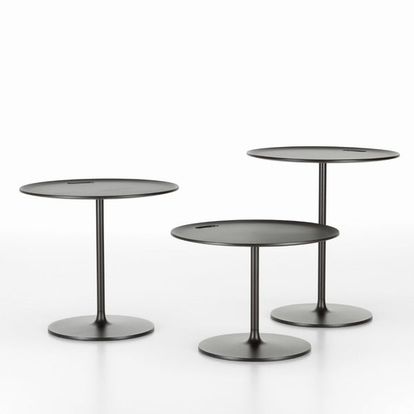 Set of three minimalist round black side tables with sleek, modern bases. Ideal for contemporary decor.