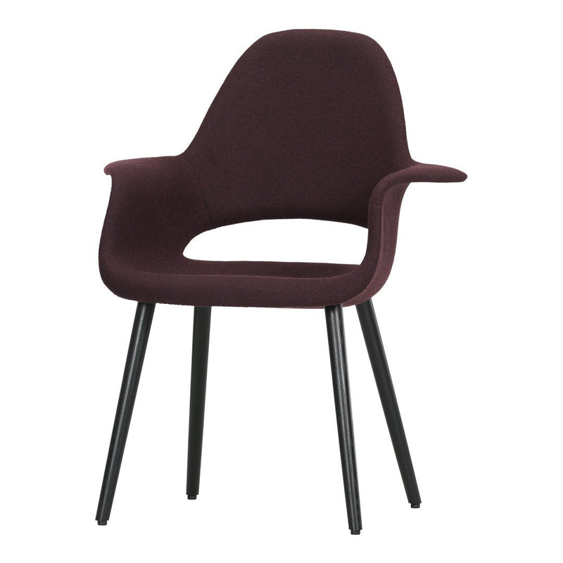 Burgundy upholstered chair with a sleek design and black legs, featuring a smooth, modern silhouette.